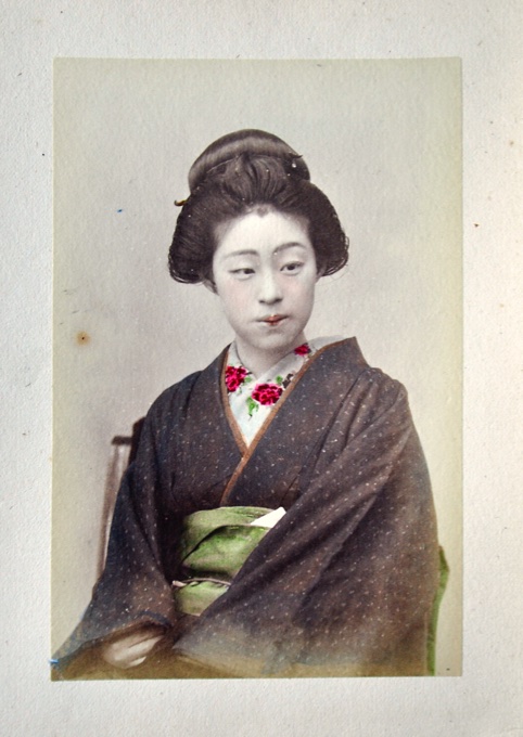 TAMAMURA, KOZABURO & KUSAKABE, KIMBEI; etc.: - [PHOTOALBUM - JAPAN]. A Japanese lacquer album with fifty hand-coloured photographs. About 1880s.
